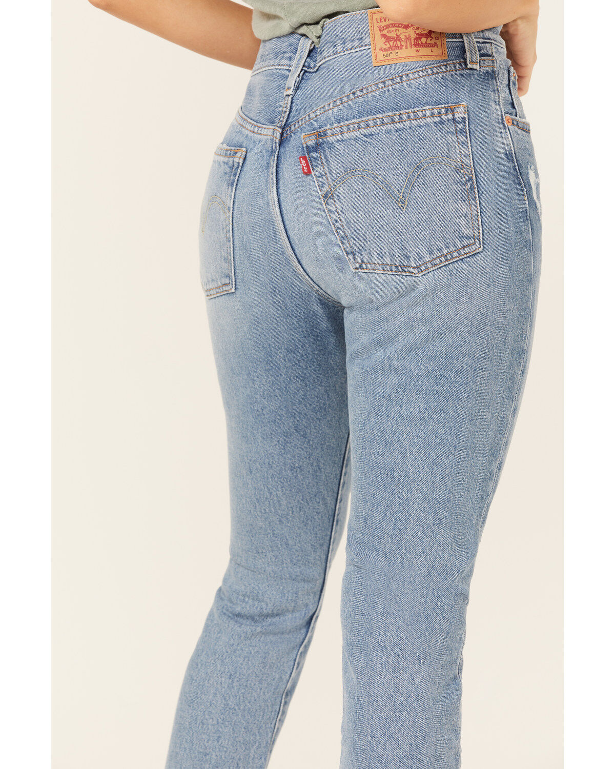 152922-levi-s-women-s-501-medium-wash-mid-rise-distressed-skinny-jeans-1.jpg