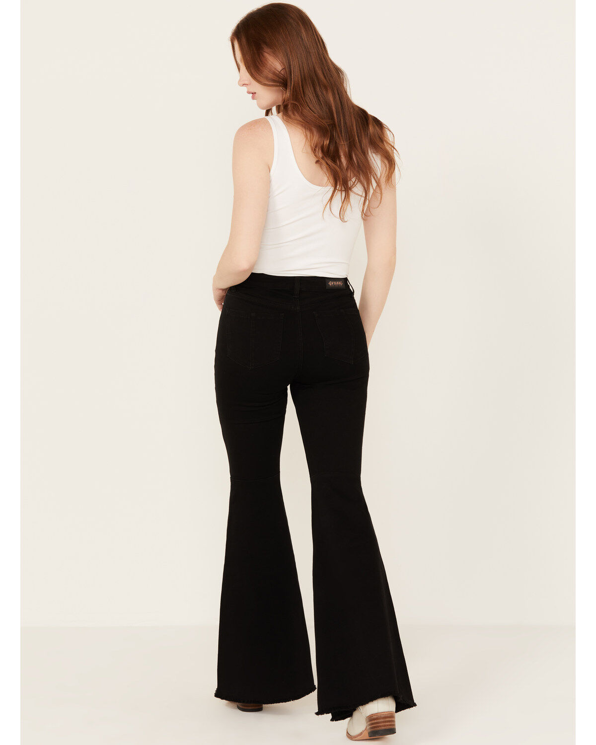 203472-shyanne-women-s-high-rise-destructed-super-flare-stretch-jeans-1.jpg