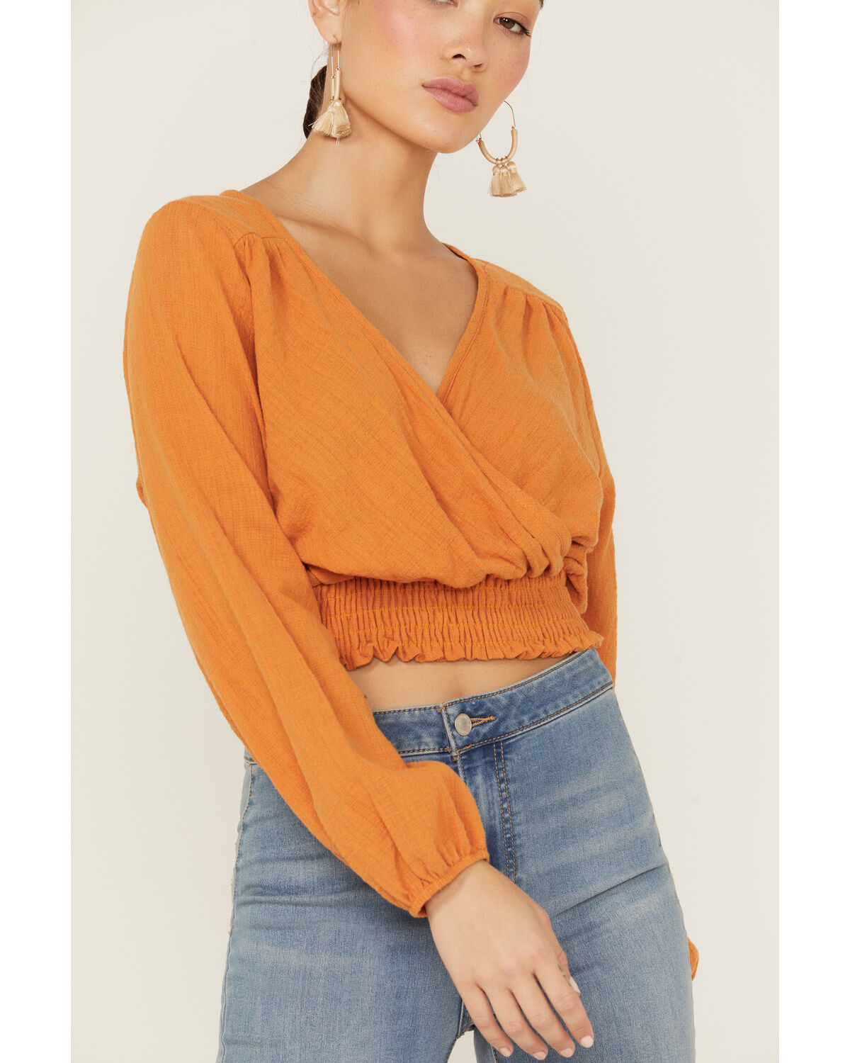 214970-saints-amp-hearts-women-s-long-sleeve-surplice-smocked-waist-crop-top-1.jpg