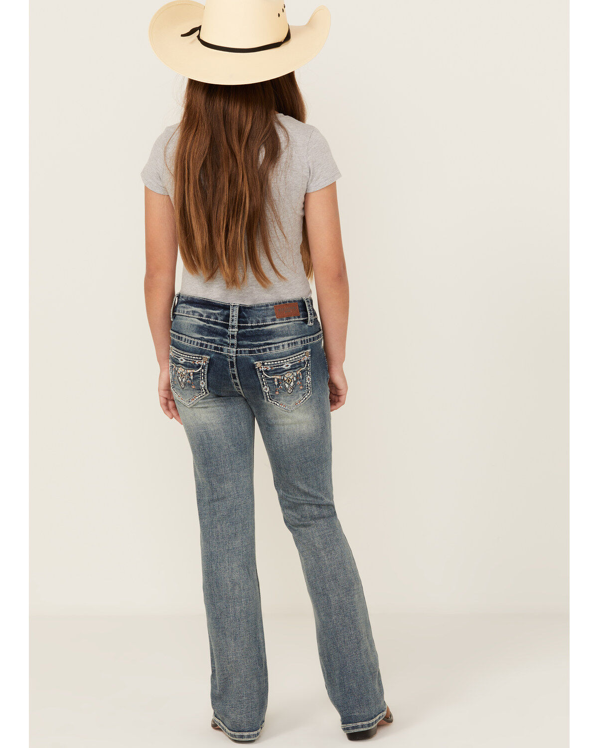 258554-shyanne-girls-light-wash-steer-head-pocket-bootcut-stretch-denim-jeans-1.jpg