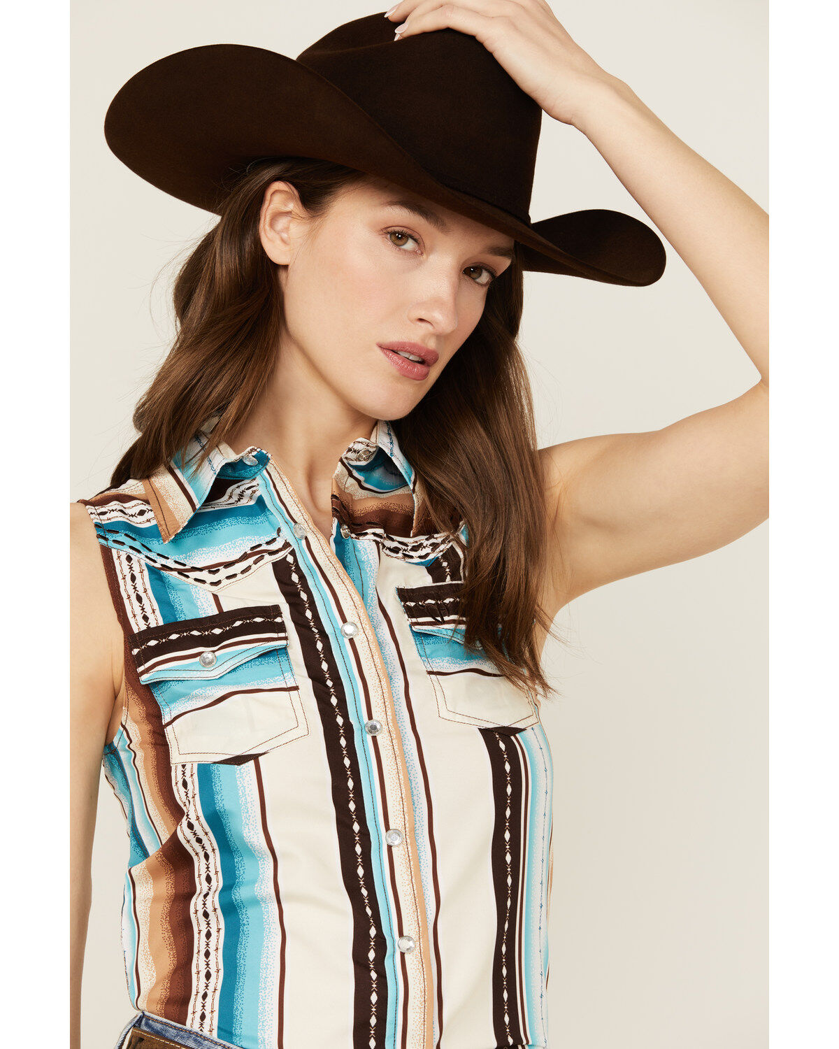 312237-cowgirl-hardware-women-s-serape-striped-sleeveless-snap-western-shirt-1.jpg